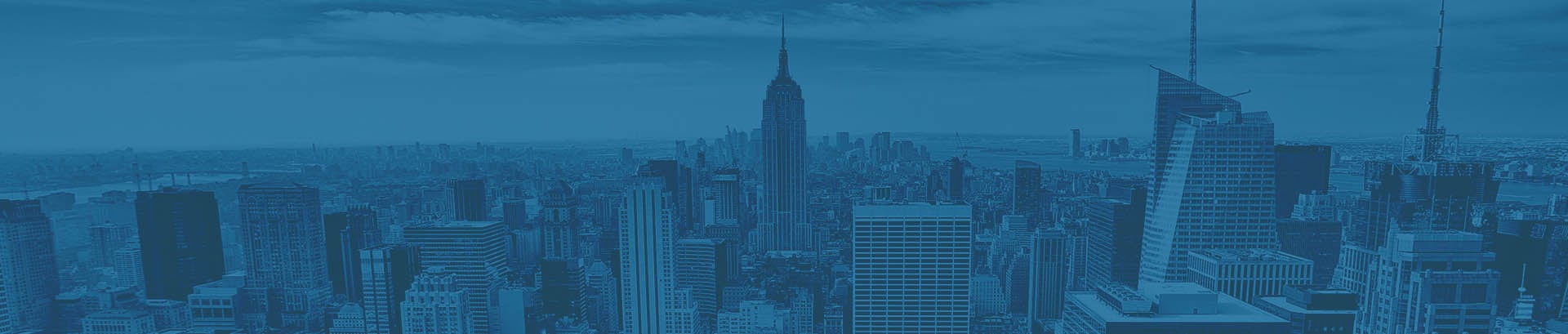 A photo of Manhattan, New York, in blue taken from a building in the financial district.