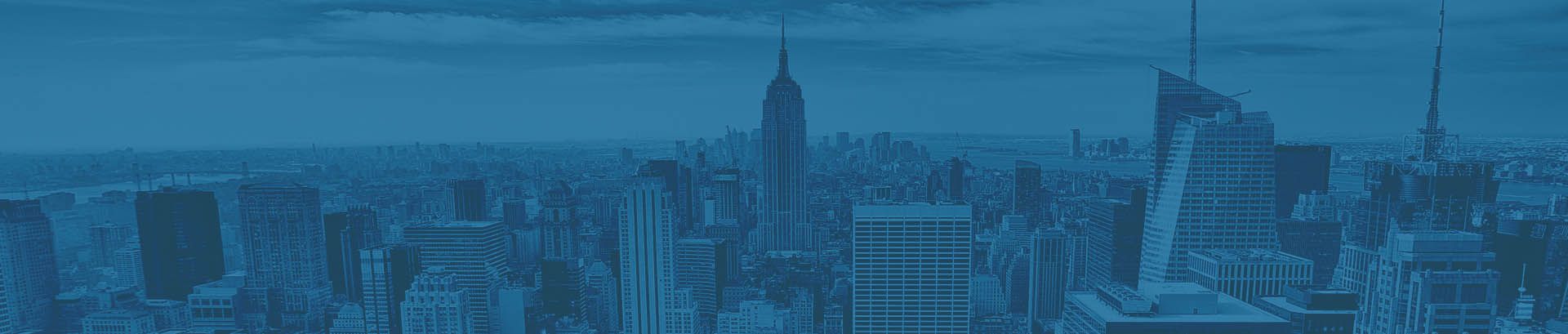 A photo of Manhattan, New York, in blue taken from a building in the financial district.